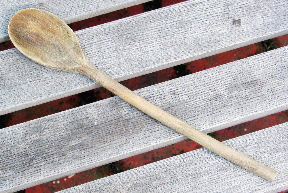 Wooden spoons on a rustic surface