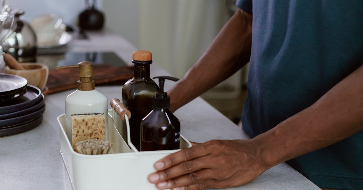 Professional cleaning supplies arranged in a modern kitchen
