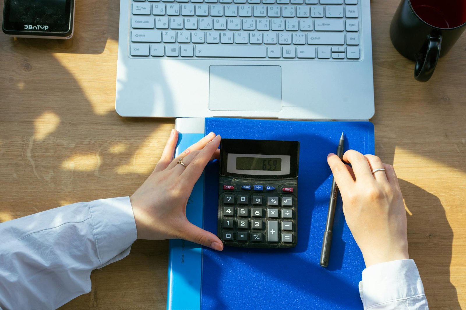 A cleaner preparing supplies and a work plan in a modern kitchen before a recurring cleaning visit