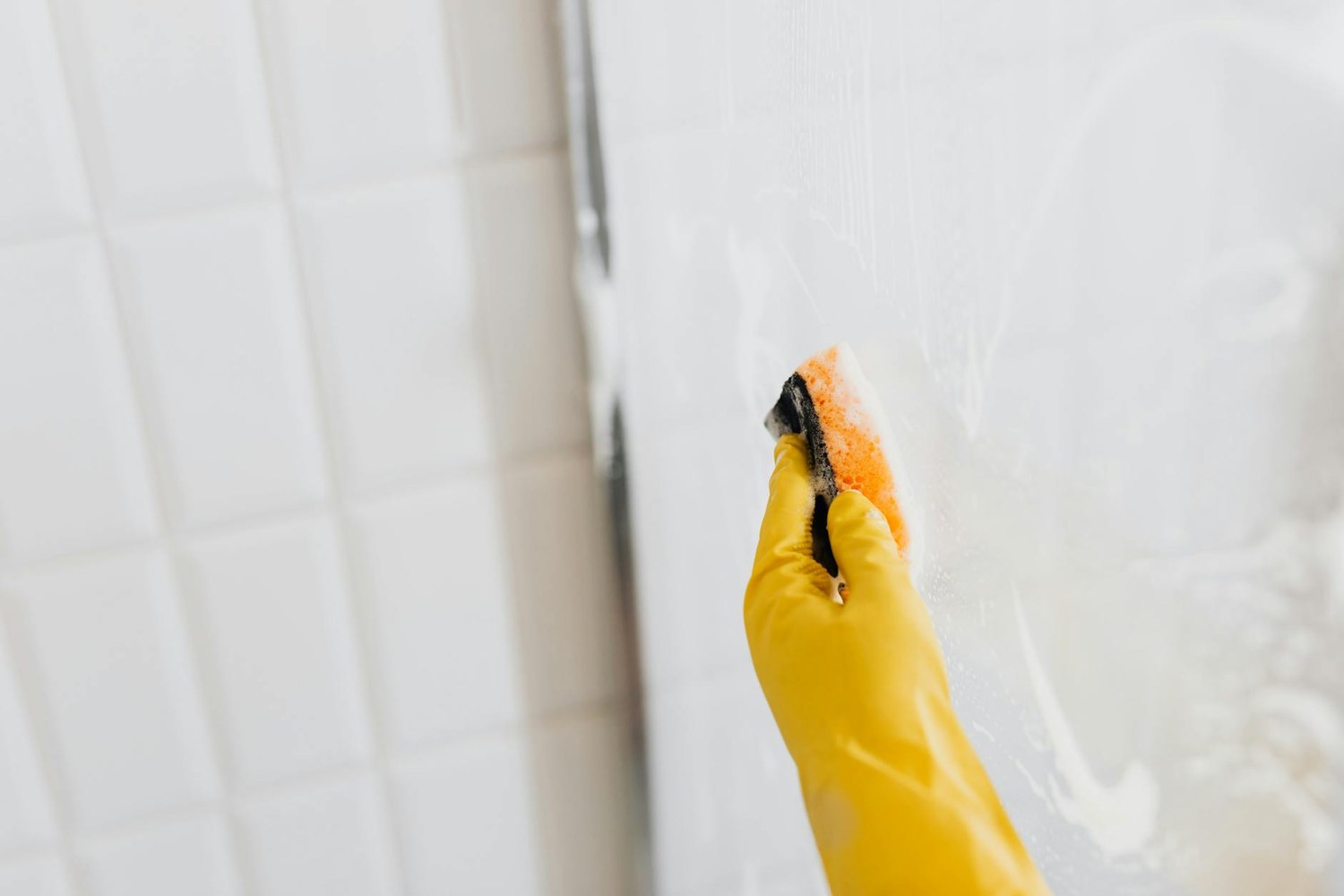 Cleaning bathroom grout and shower surfaces in detail